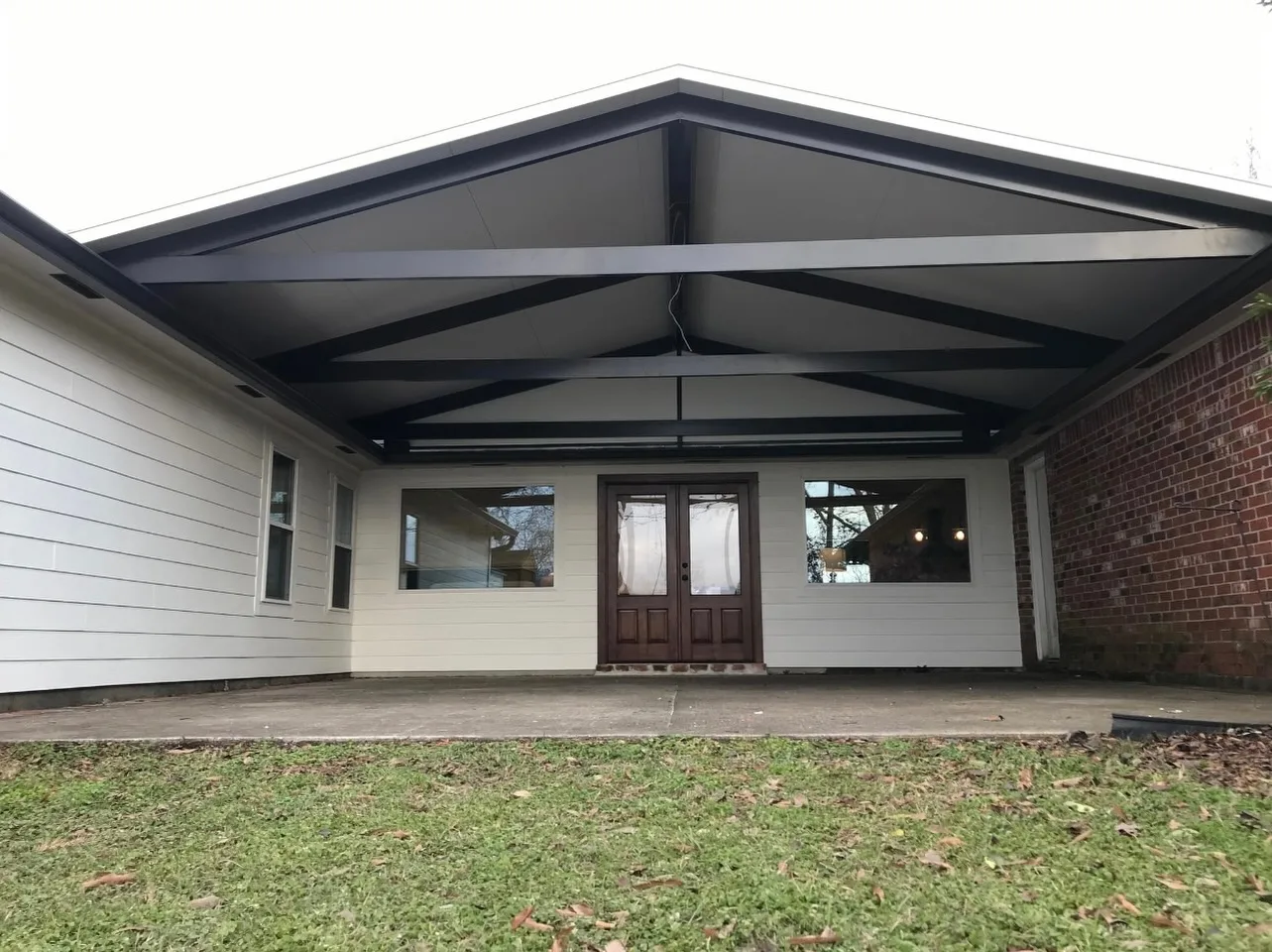 Covered residential addition with new gable framing