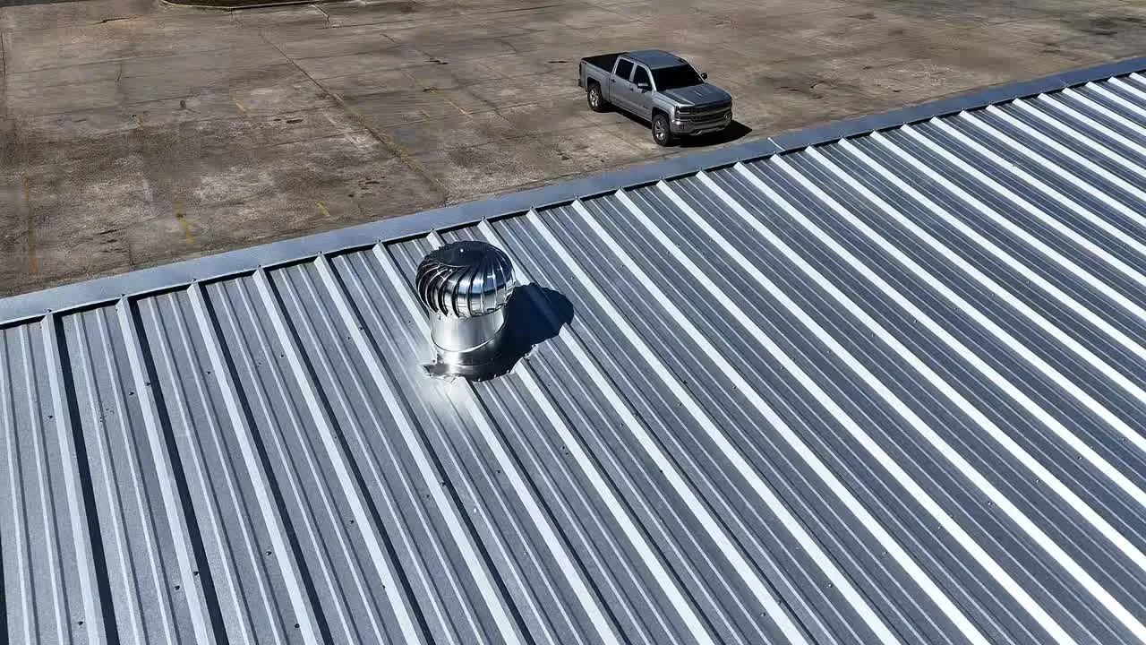 Standing-seam metal roof with rooftop vent and truck